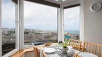 The views from the dining table are stunning; overlooking Smeaton's Pier and stretching out beyond Godrevy Lighthouse.