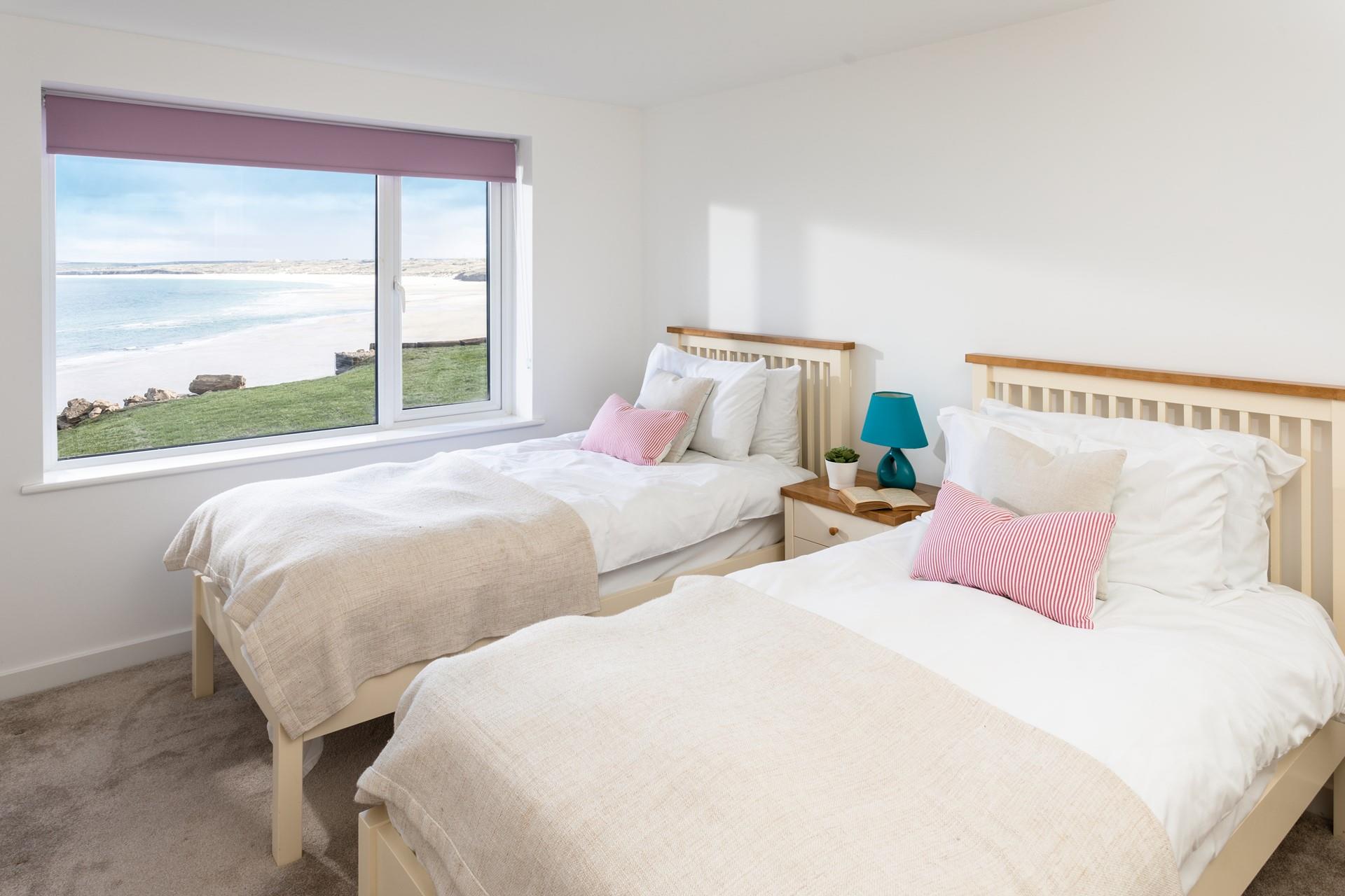 The bedrooms are sumptuous with minimalistic decor, creating a soothing space to unwind.