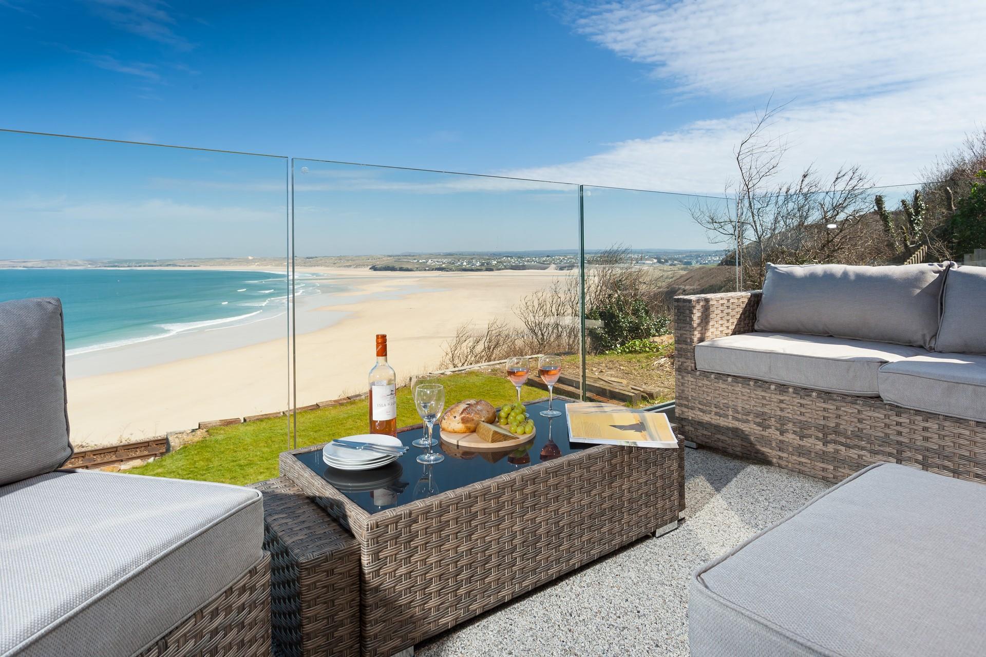 Sit in the sunshine on the rattan furniture with a cold glass of wine.