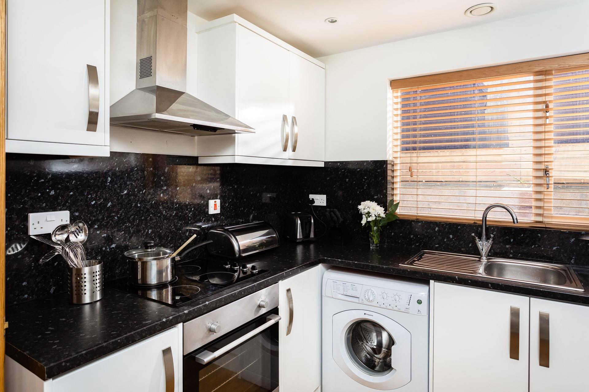 The kitchen is well-equipped with everything you for your stay at Trelawney, including a washing machine. 