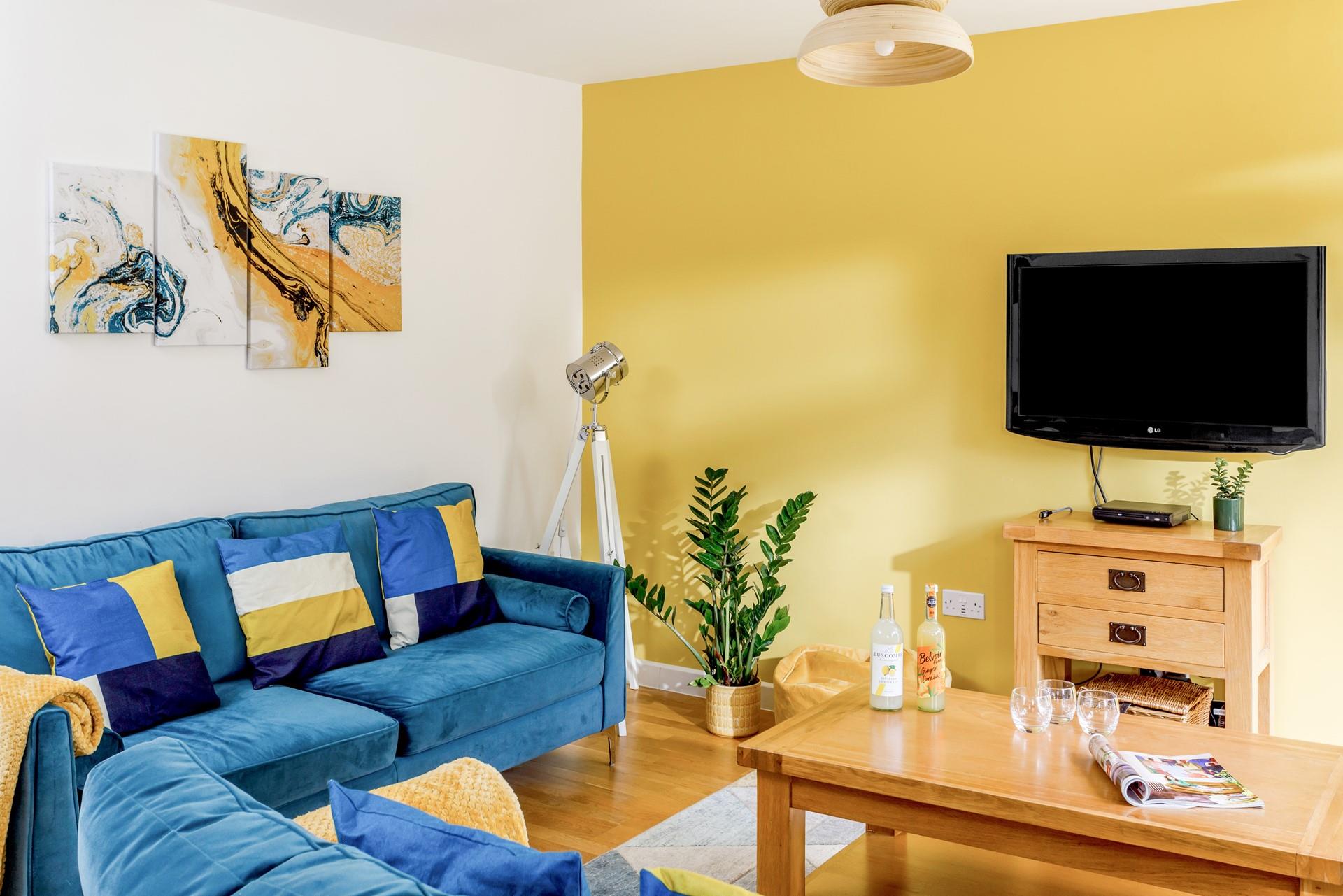 Relax in your vibrant sitting room after a day of exploring Cornwall.