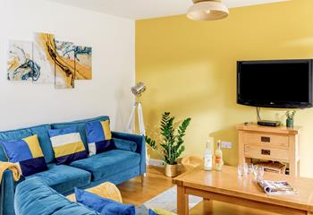 Relax in your vibrant sitting room after a day of exploring Cornwall.