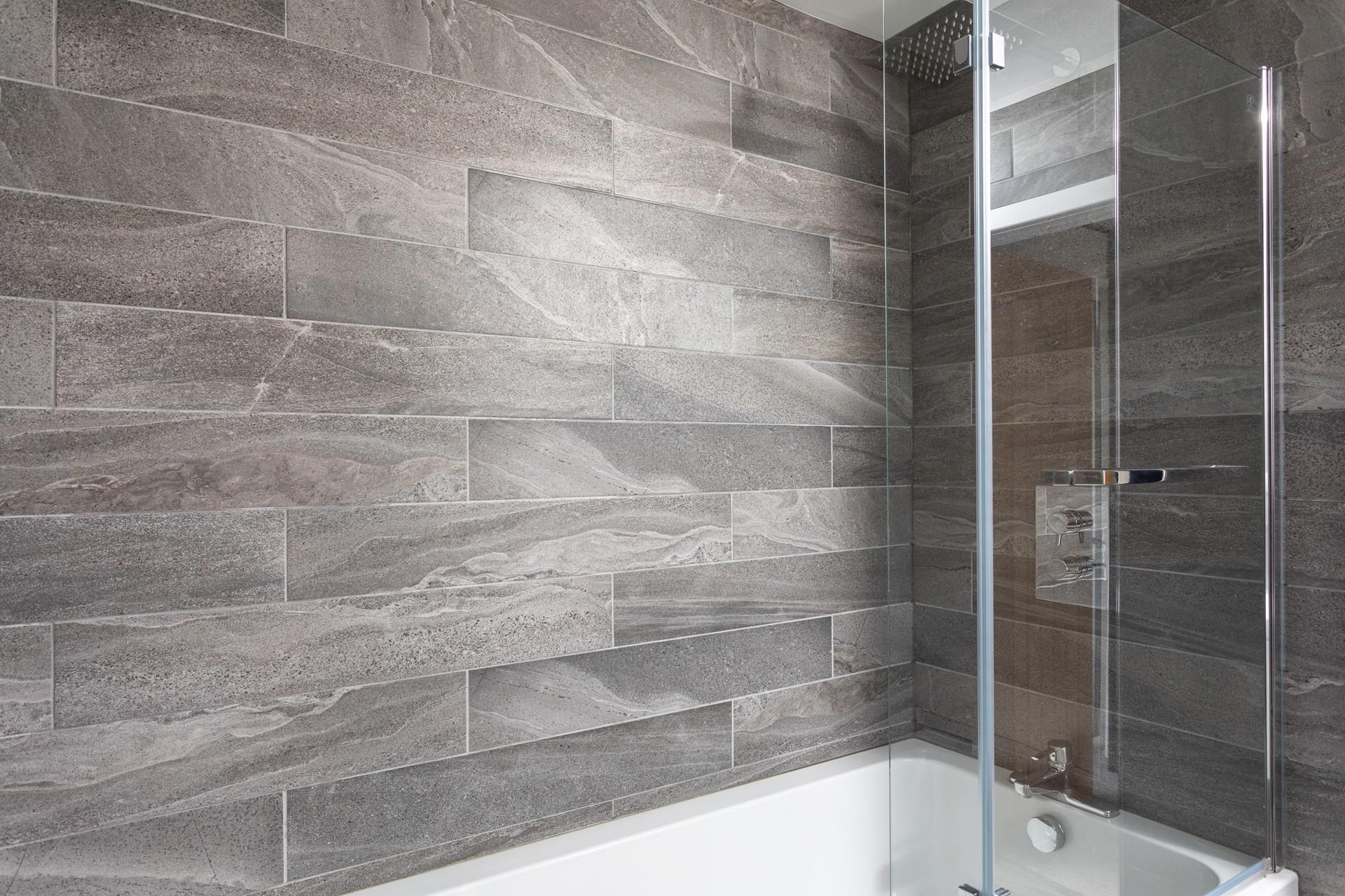 The family bathroom has a rainfall shower and a relaxing bath to choose from.