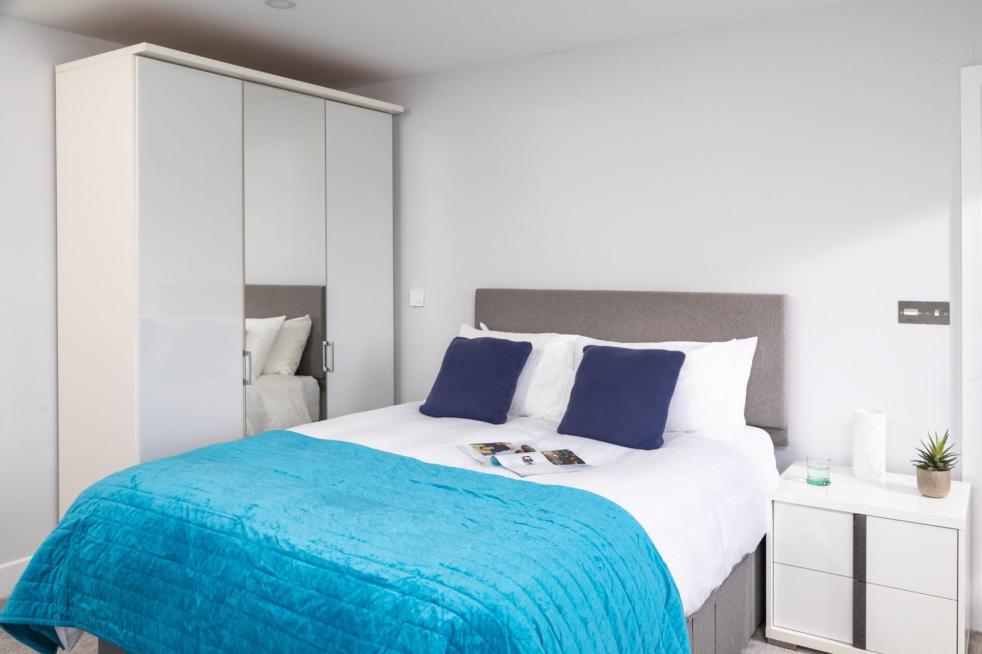 Bedroom 1 has a large wardrobe and ample storage space.