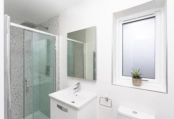 Bedroom 1 has a luxurious rainfall shower to wake you up in the morning.