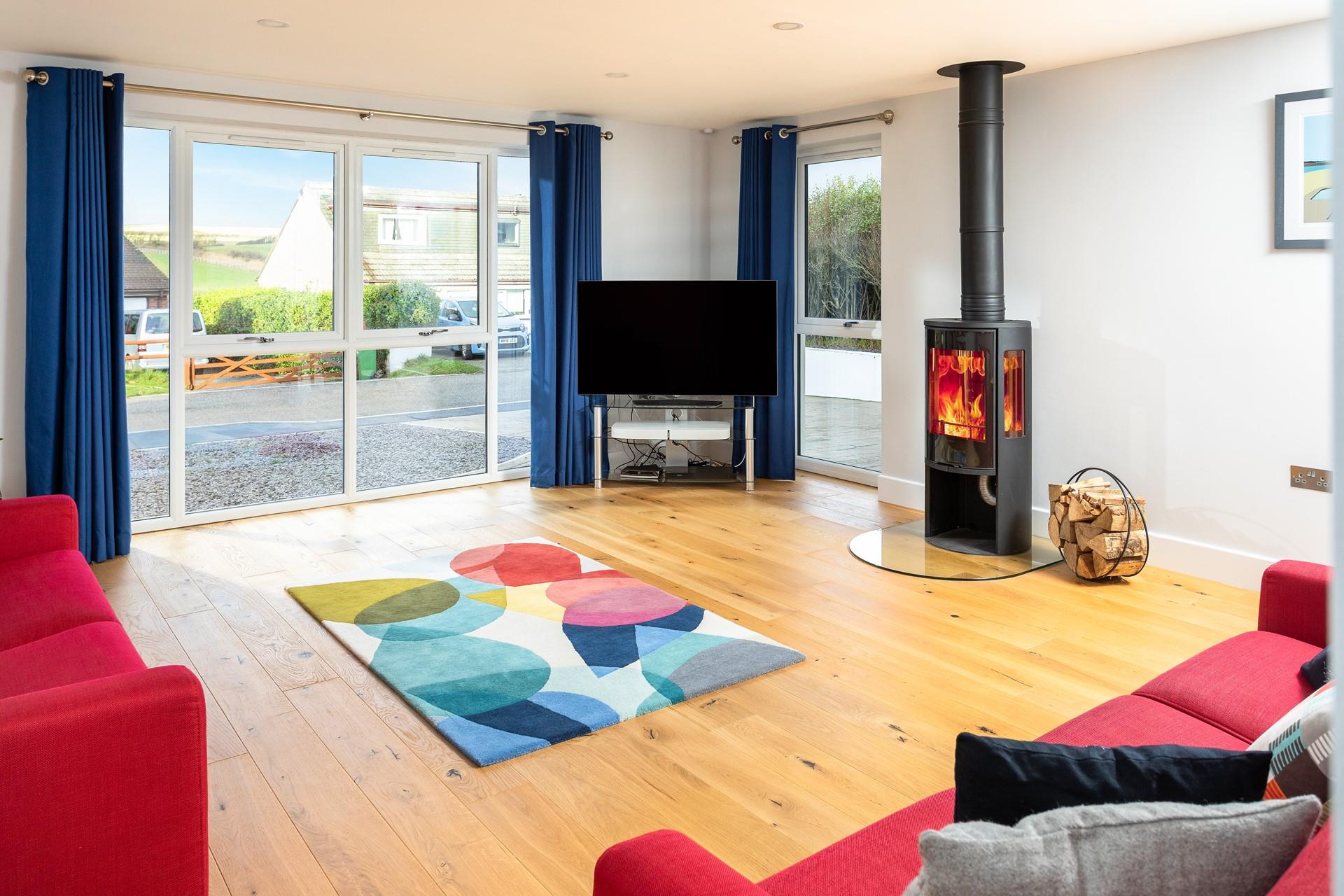 Bright and spacious, the sitting room is the perfect space to relax and unwind, light the woodburner and enjoy the far-reaching views. 