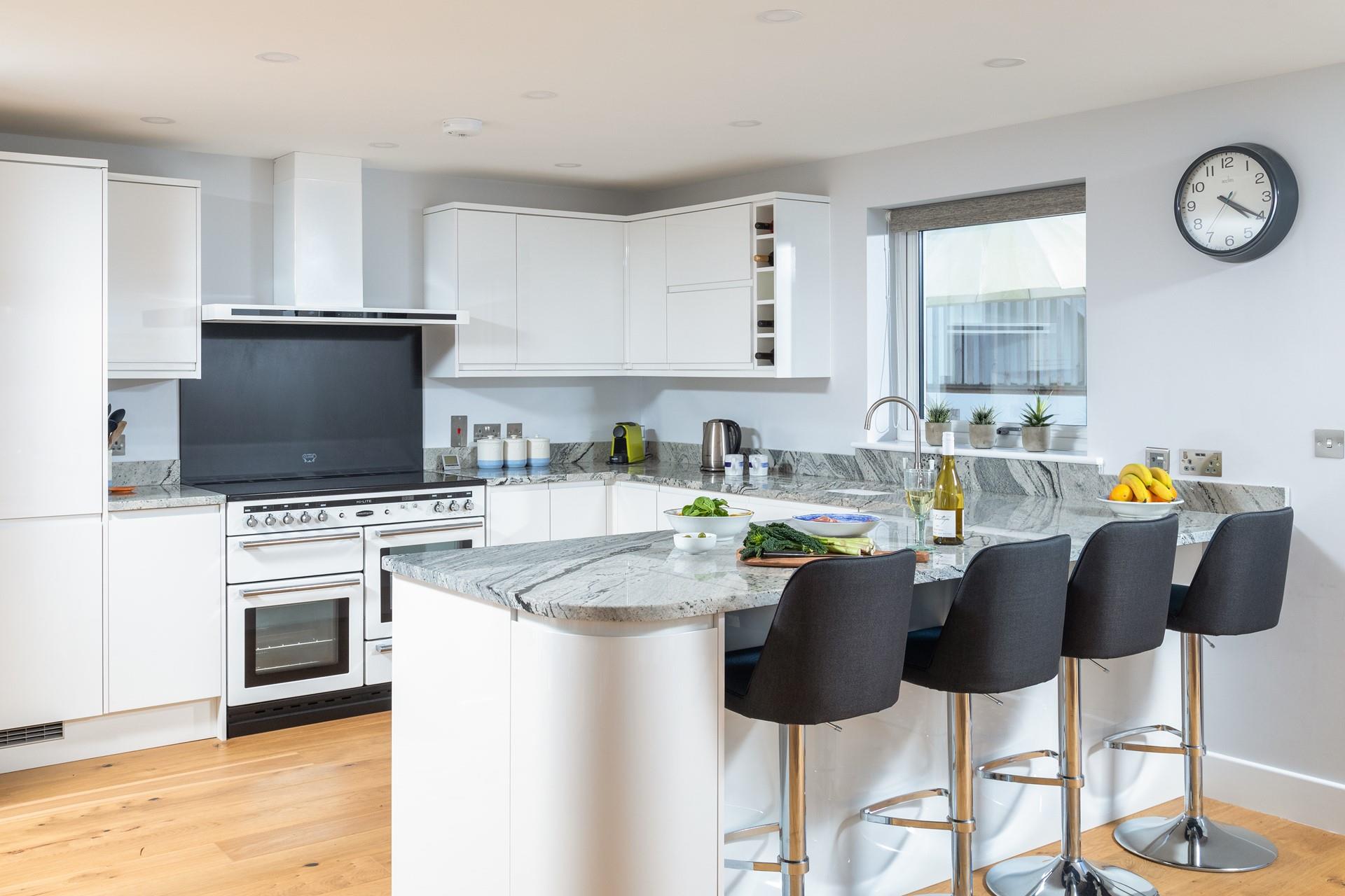 The kitchen is well-equipped including a Rangemaster cooker, Magimix coffee machine and a well-sized breakfast bar.