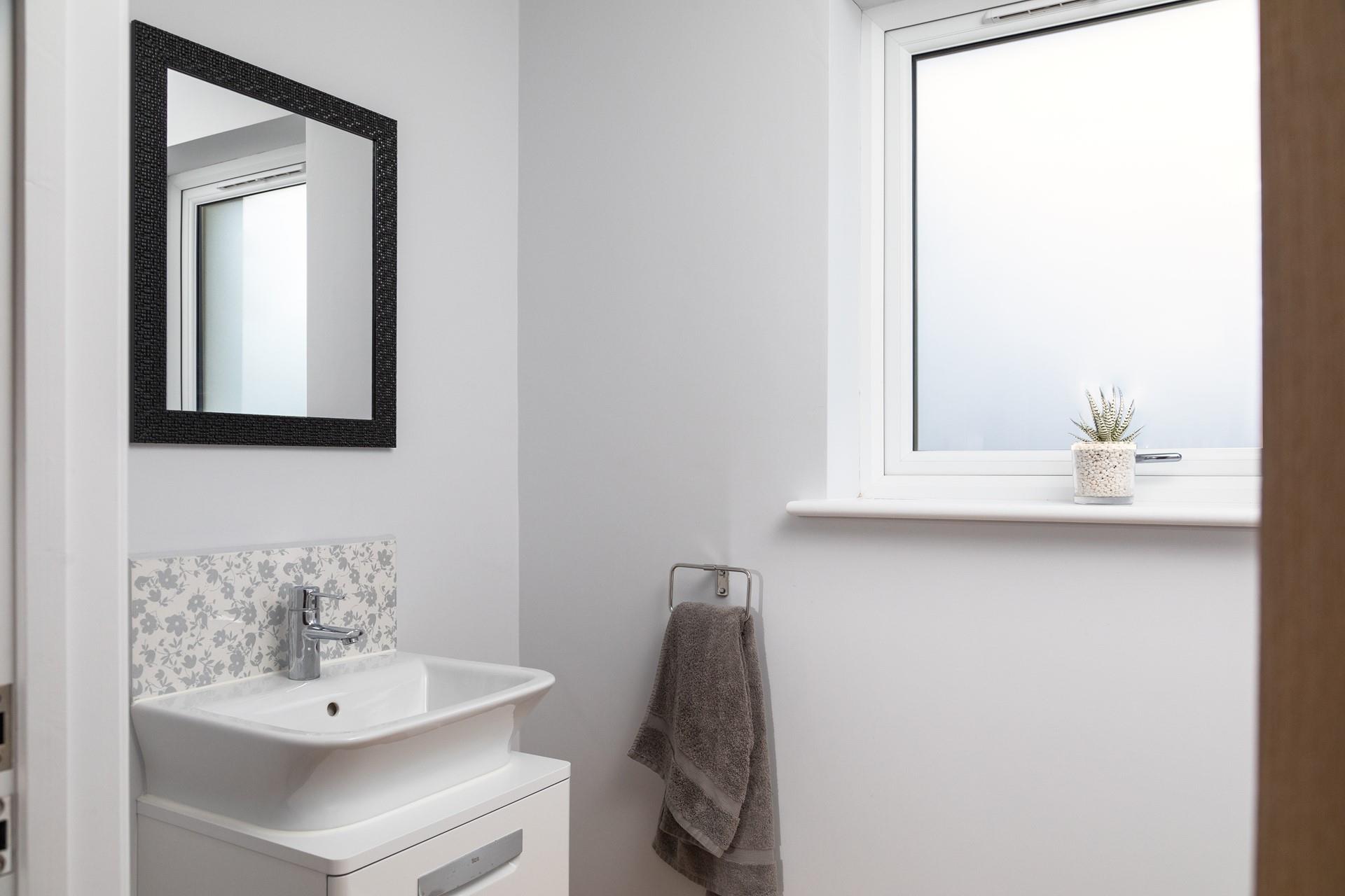 The cloakroom has an additional basin and WC.