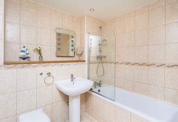 The family bathroom is spacious and practical, perfect for the whole party. 