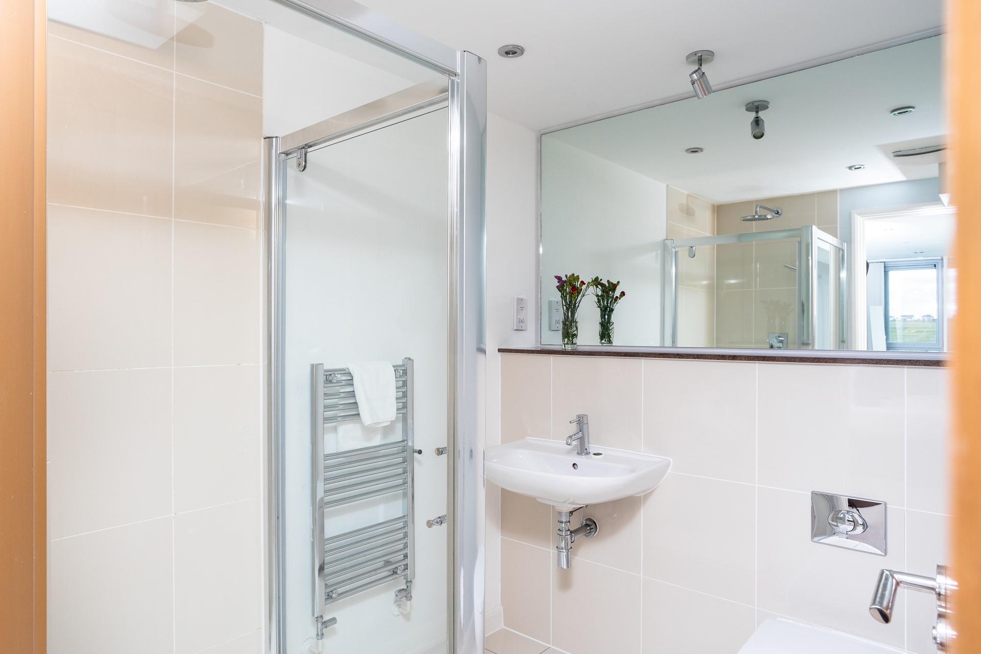 Enjoy a spa-like experience under the rain fall shower head. 