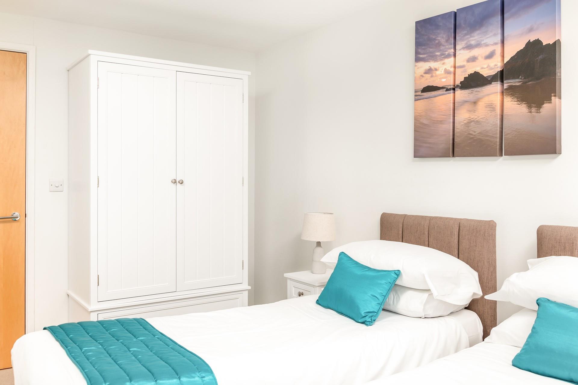 A large wardrobe offers you plenty of storage for your holiday best.