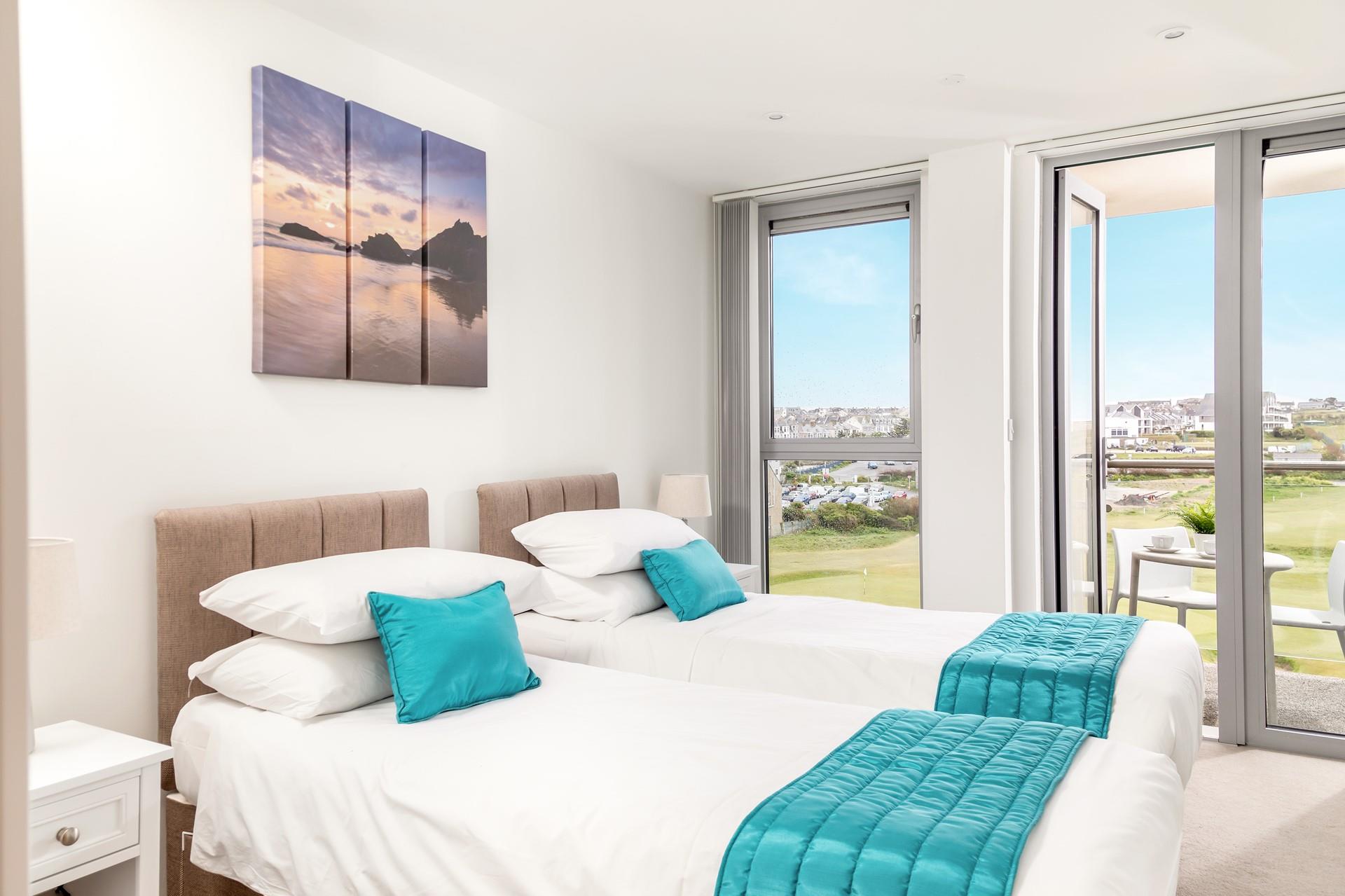 Zip and link beds in bedroom 2 provide flexible sleeping arrangements for both children and couples. 