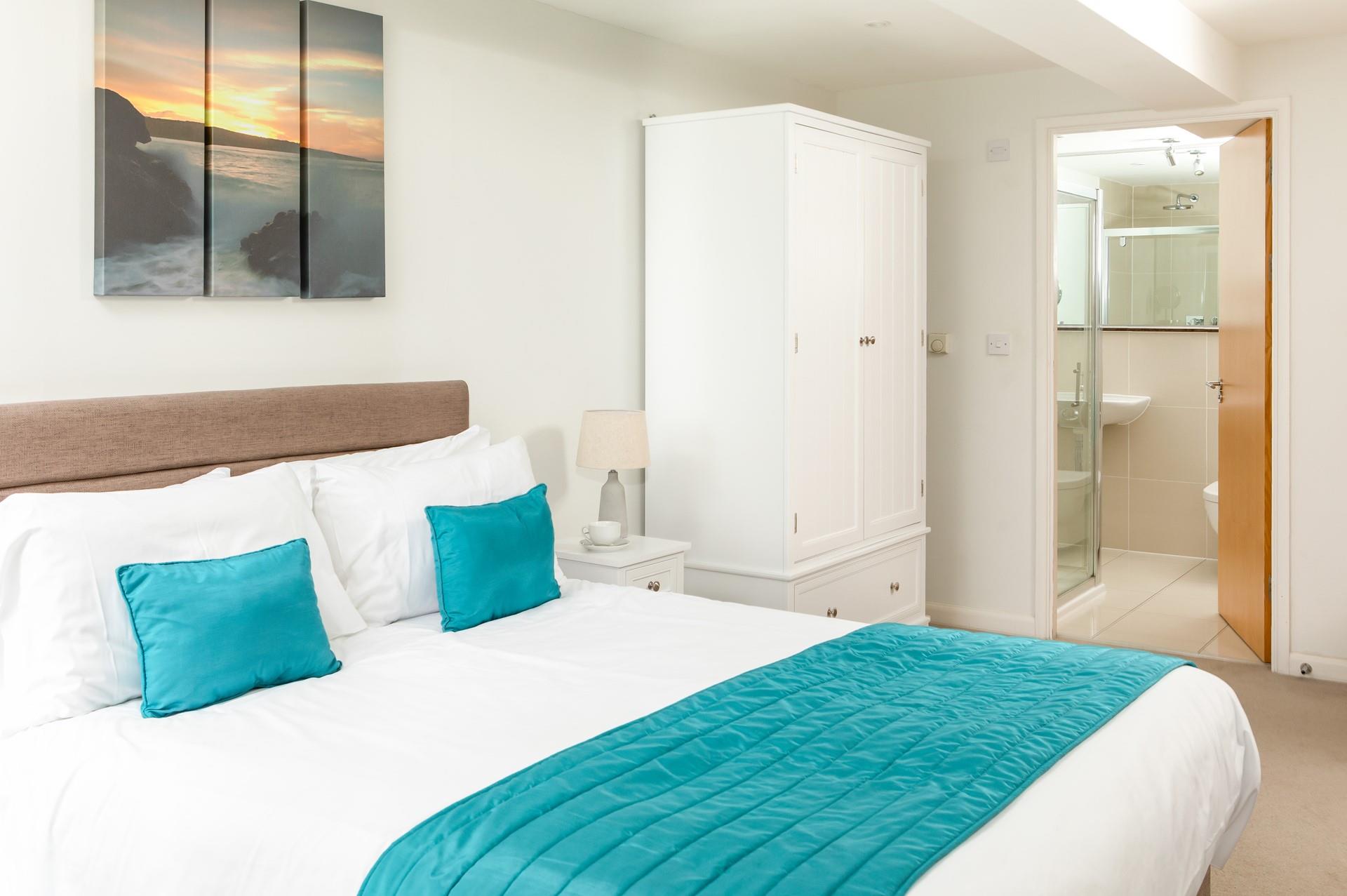 Bedroom 1 benefits from an en suite shower room, offering privacy and convenience for guests. 