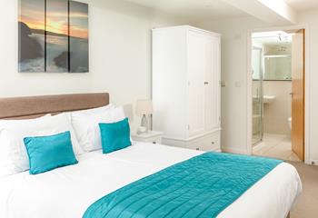 Bedroom 1 benefits from an en suite shower room, offering privacy and convenience for guests. 