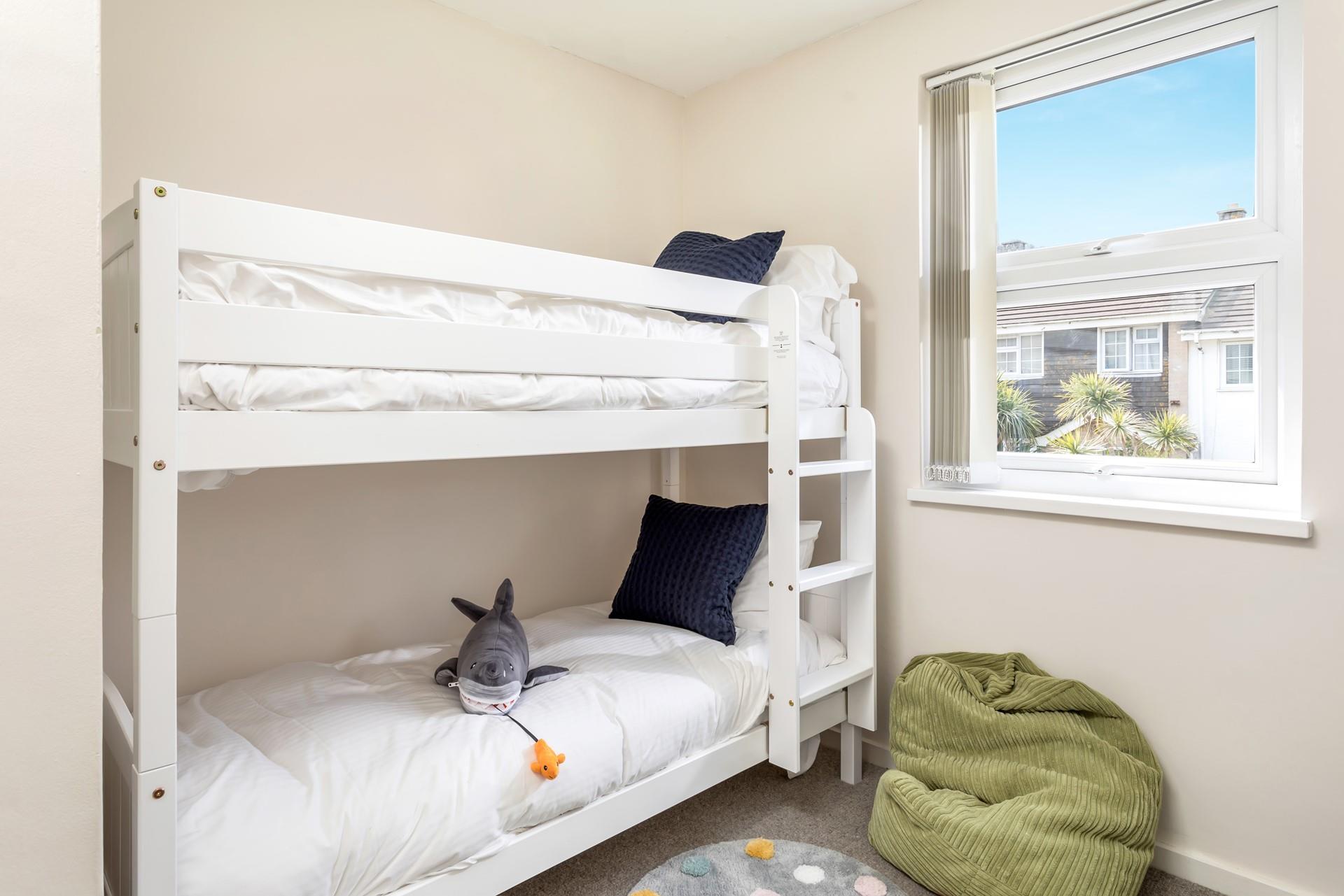 Light and airy, bedroom 3 is cosy and comfortable for kids. 