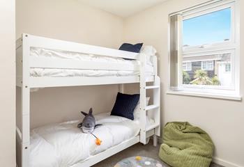 Light and airy, bedroom three is cosy and comfortable for kids. 