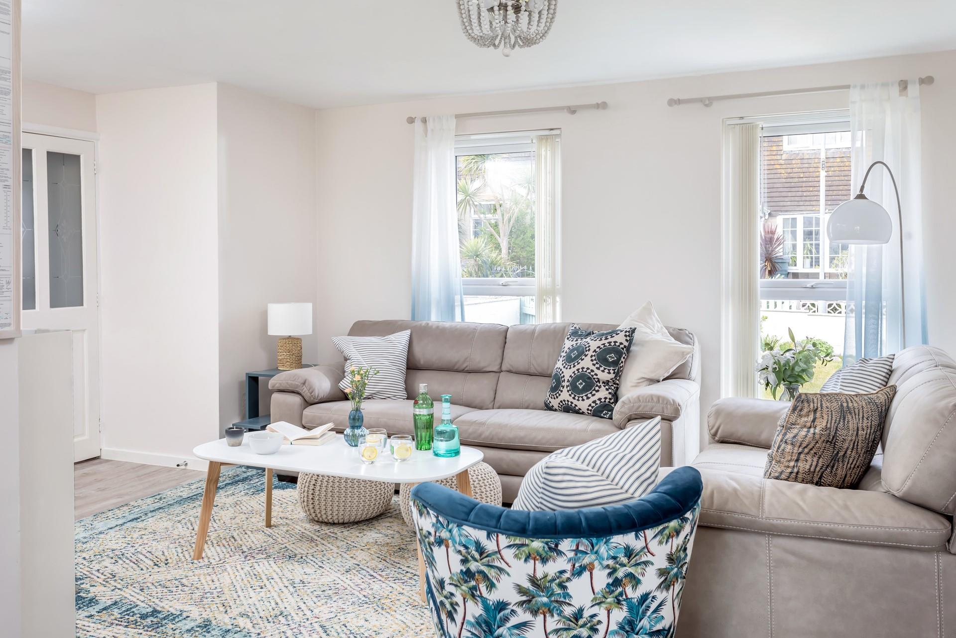 Stylish soft furnishings add a luxurious finish to the sitting room. 