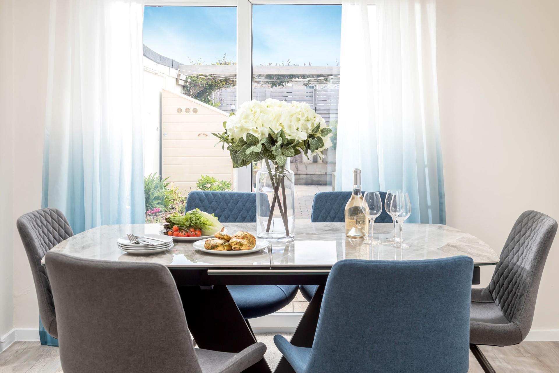 Calming hues of blue reflect the property's proximity to the sea. 