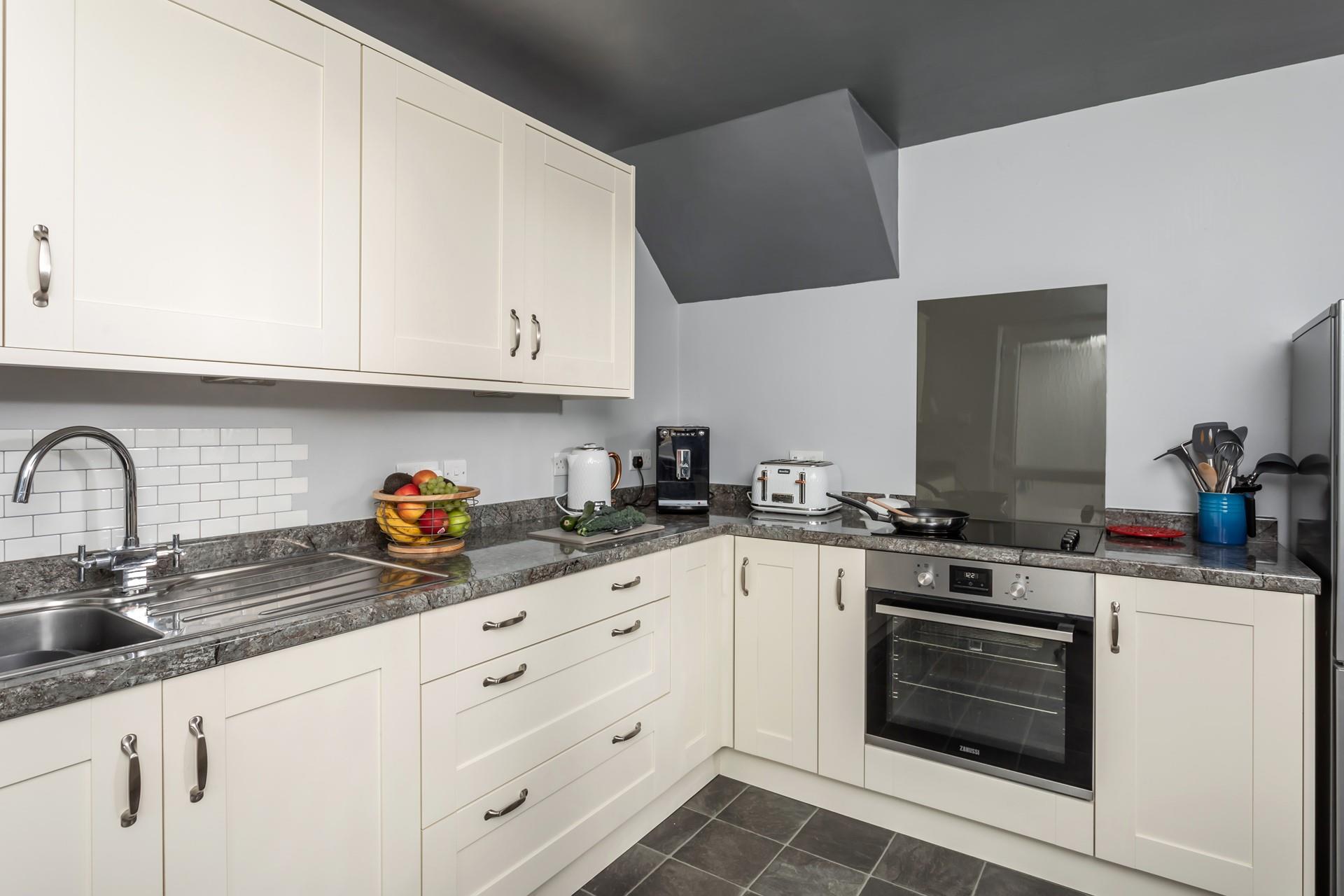 Fully equipped, the kitchen has all you need for your stay at Number 6. 