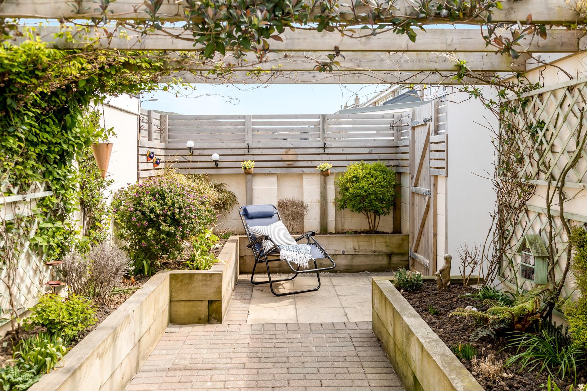 Step through the pergola and take a moment to yourself; relax on the lounger and enjoy the sunshine. 