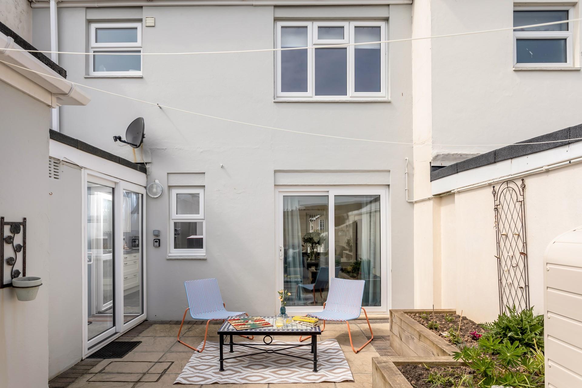 Step through the patio doors and enjoy a drink outside in the early evening sun. 