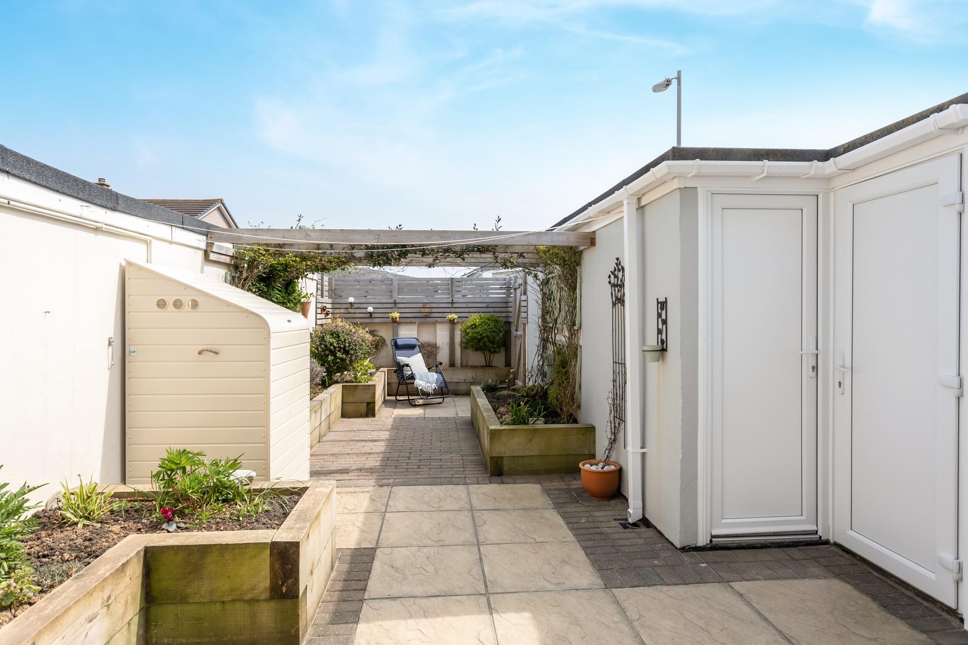 Number 6 benefits from a large, enclosed, private patio. 