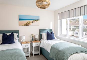 We love the coastal colours and décor in the bright twin room. 
