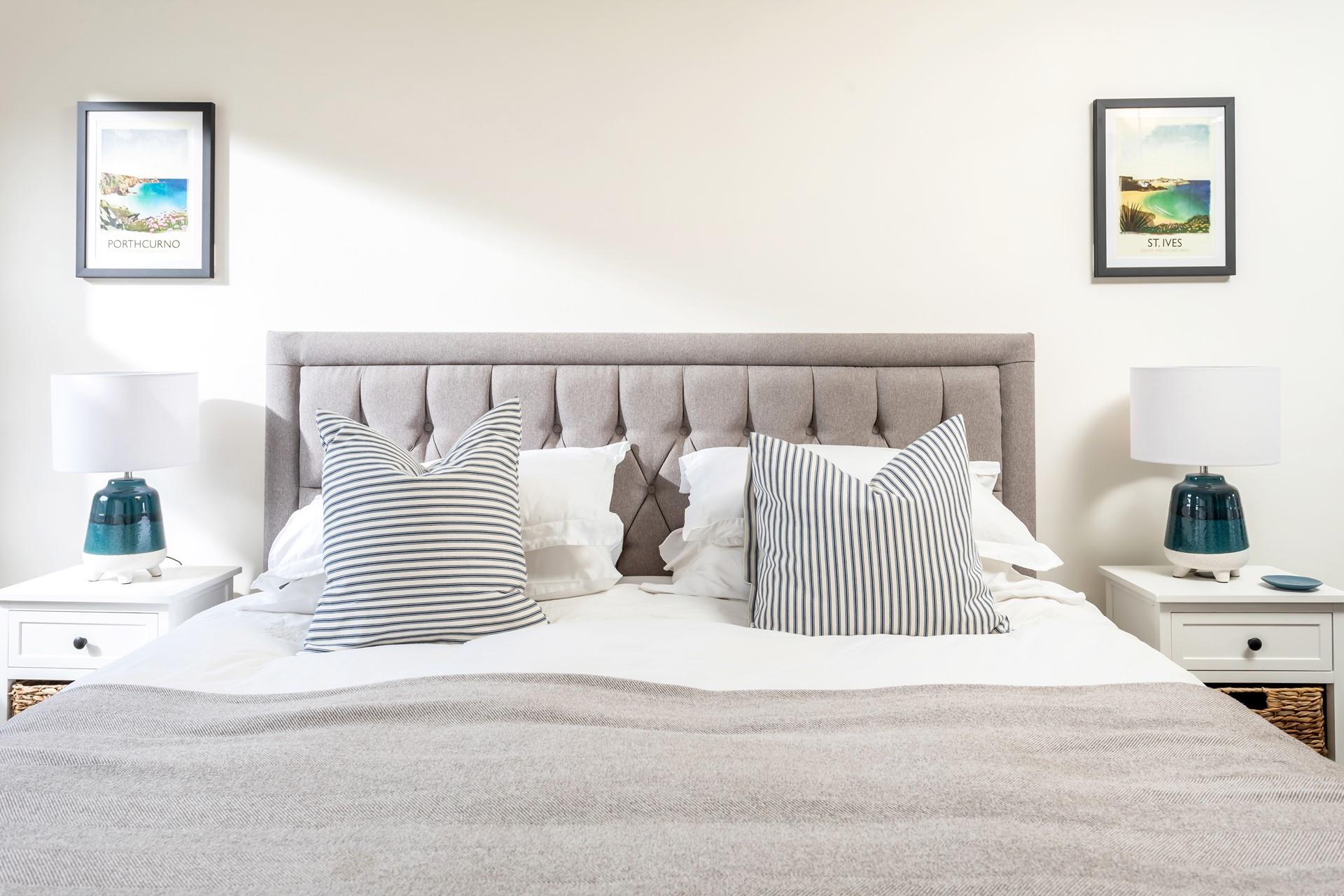 Crisp white linen and plump cushions promise a dreamy night's sleep. 
