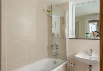 The family bathroom is spacious and with a bath and a shower, ideal for getting ready for the day. 