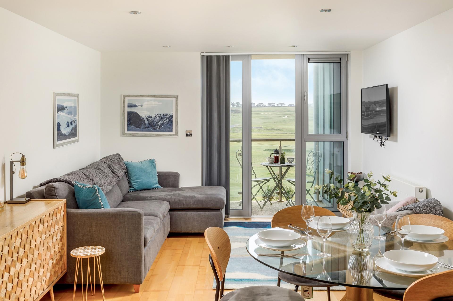 The stylish open plan living area has all you need for a self catering holiday by the sea. 