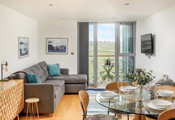 The stylish open plan living area has all you need for a self catering holiday by the sea. 