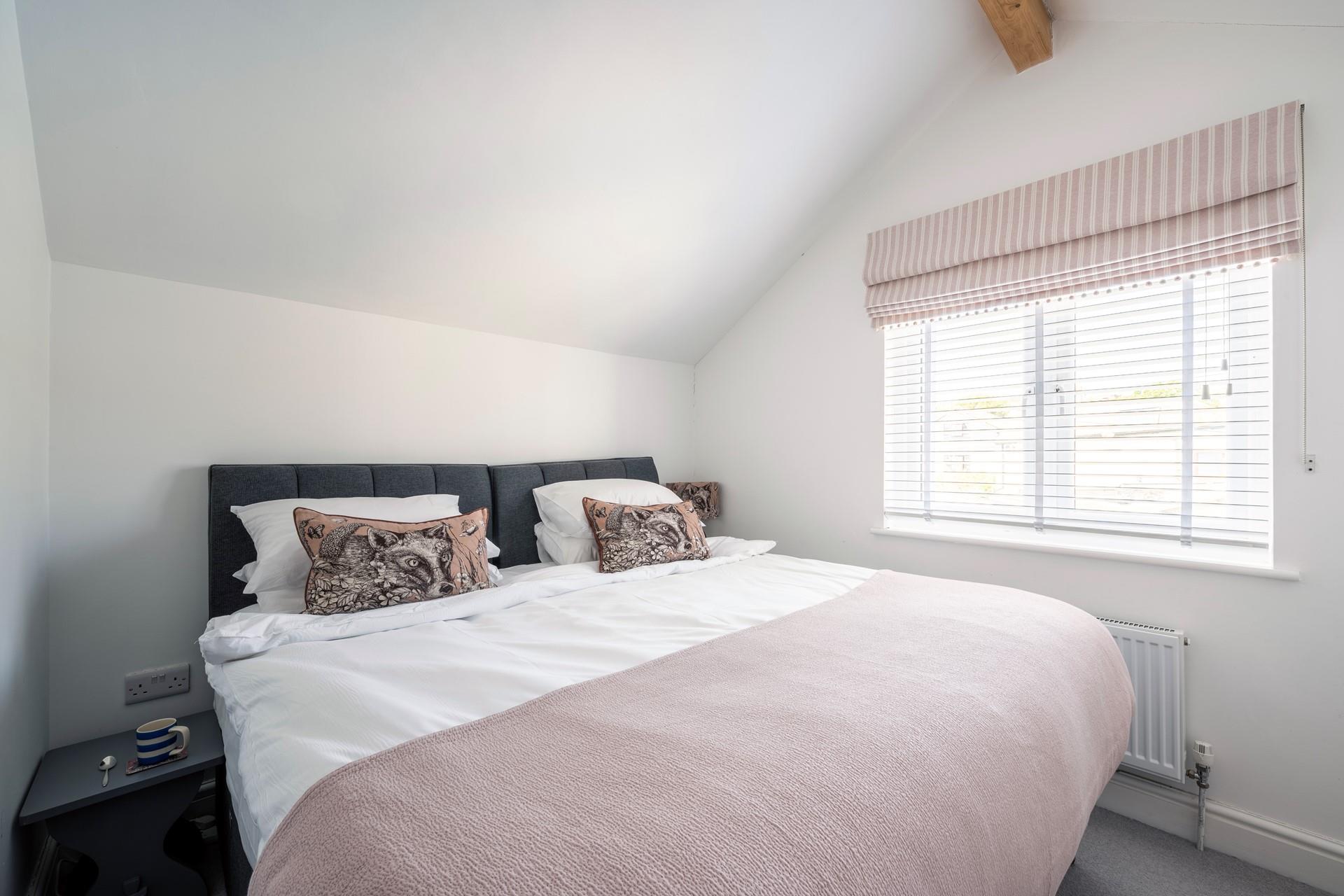 Bedroom 2 has zip and link beds so this cottage is great for families or two couples.