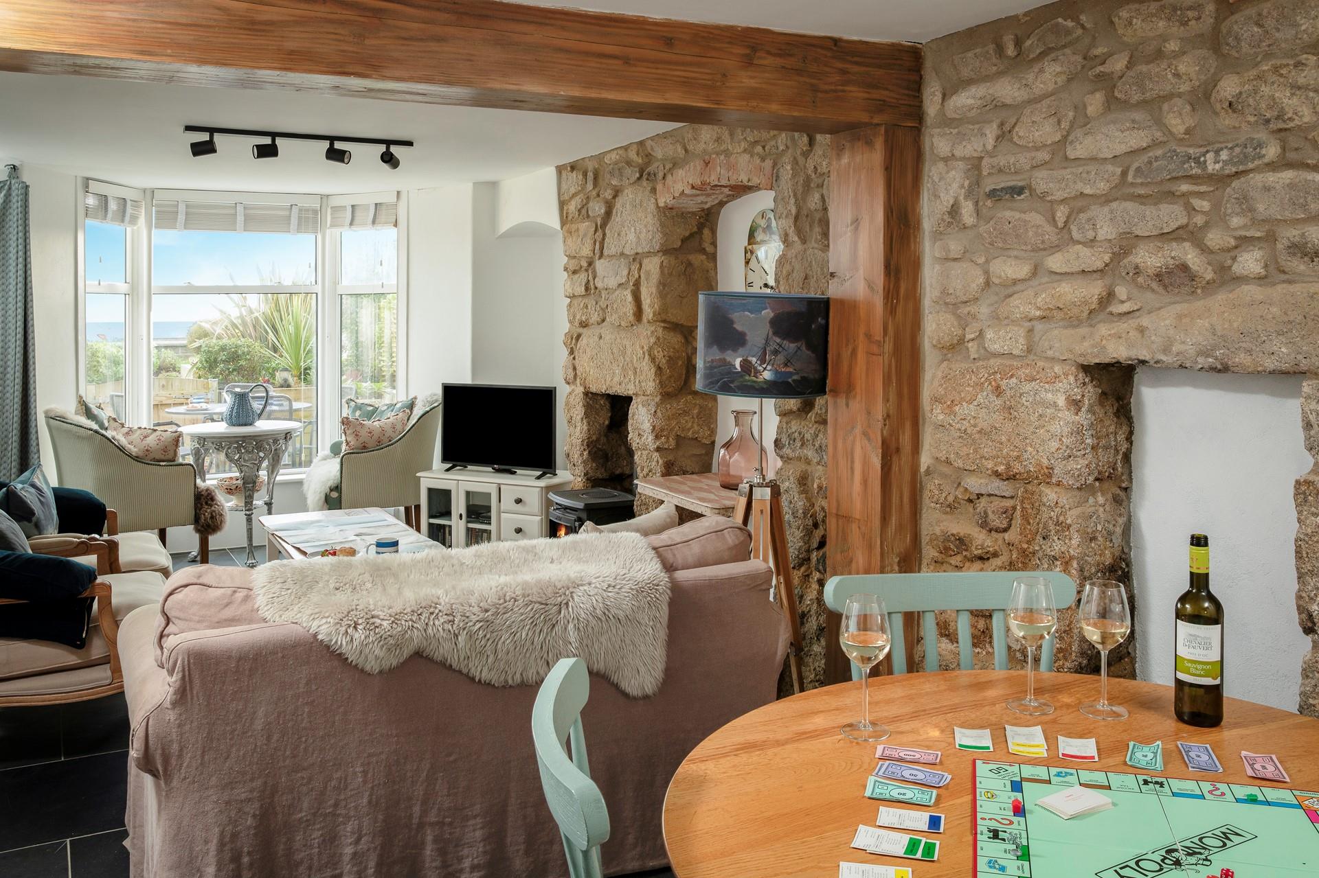 Cosy up within the granite walls of the cottage after spending the day walking the coast path.