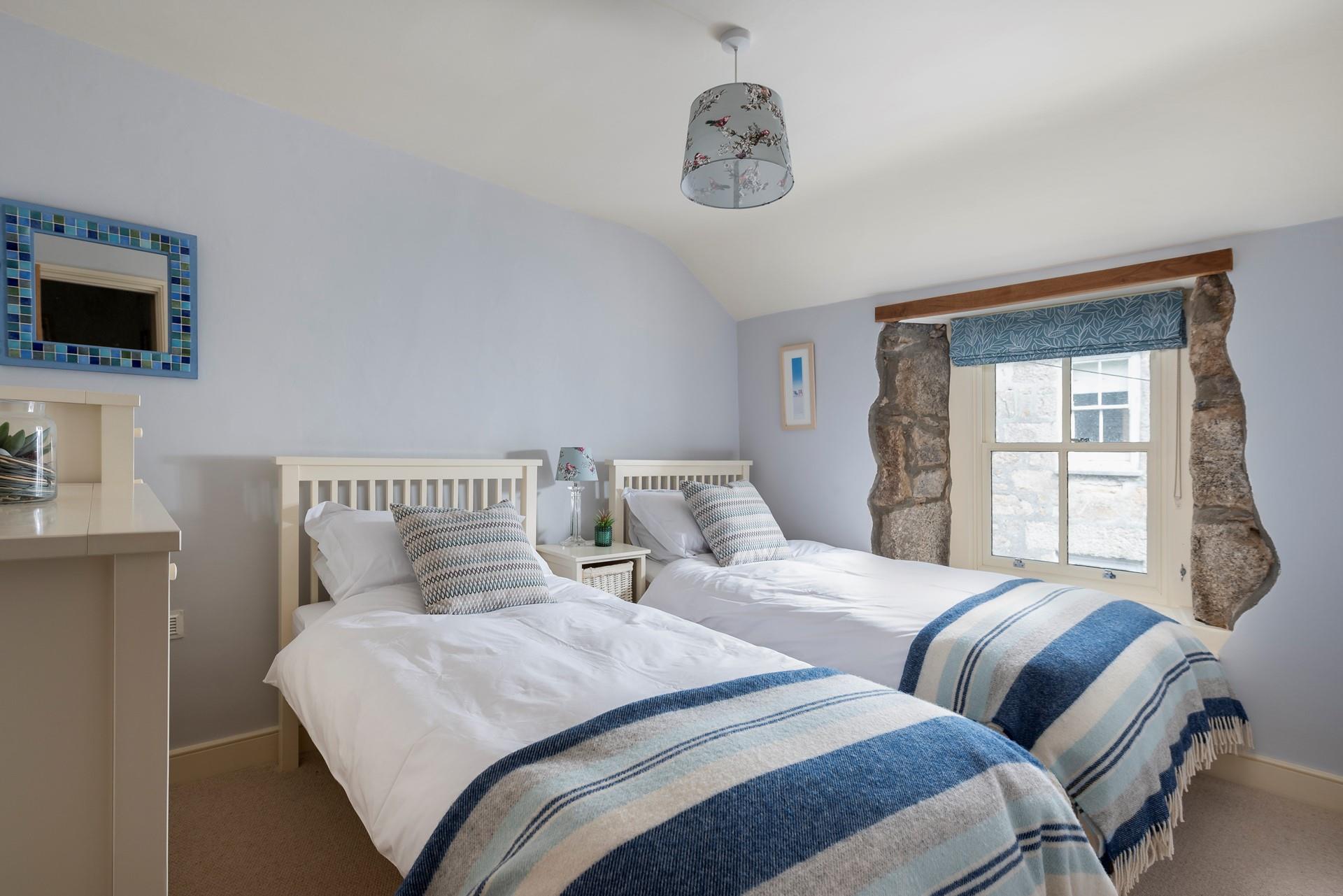 Sumptuous twin beds promise a dreamy night's sleep for guests staying in bedroom 2. 