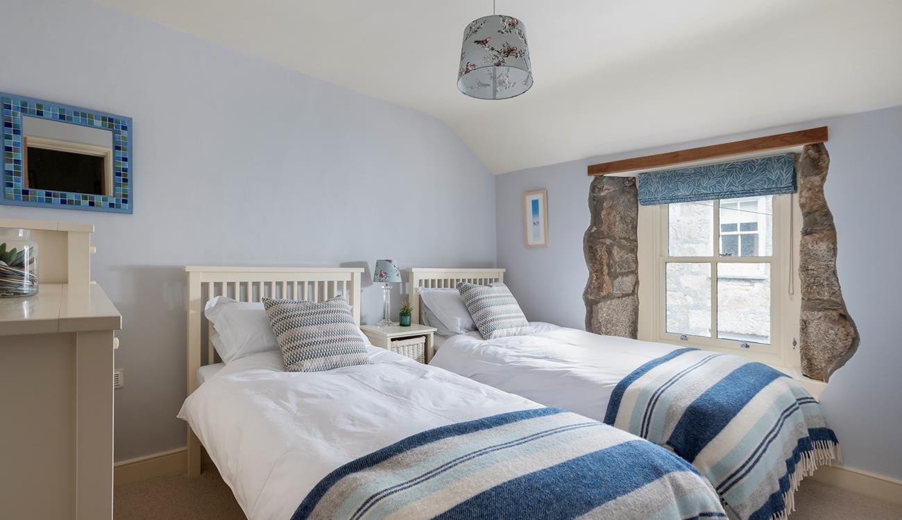 Sumptuous twin beds promise a dreamy night's sleep for guests staying in bedroom 2. 