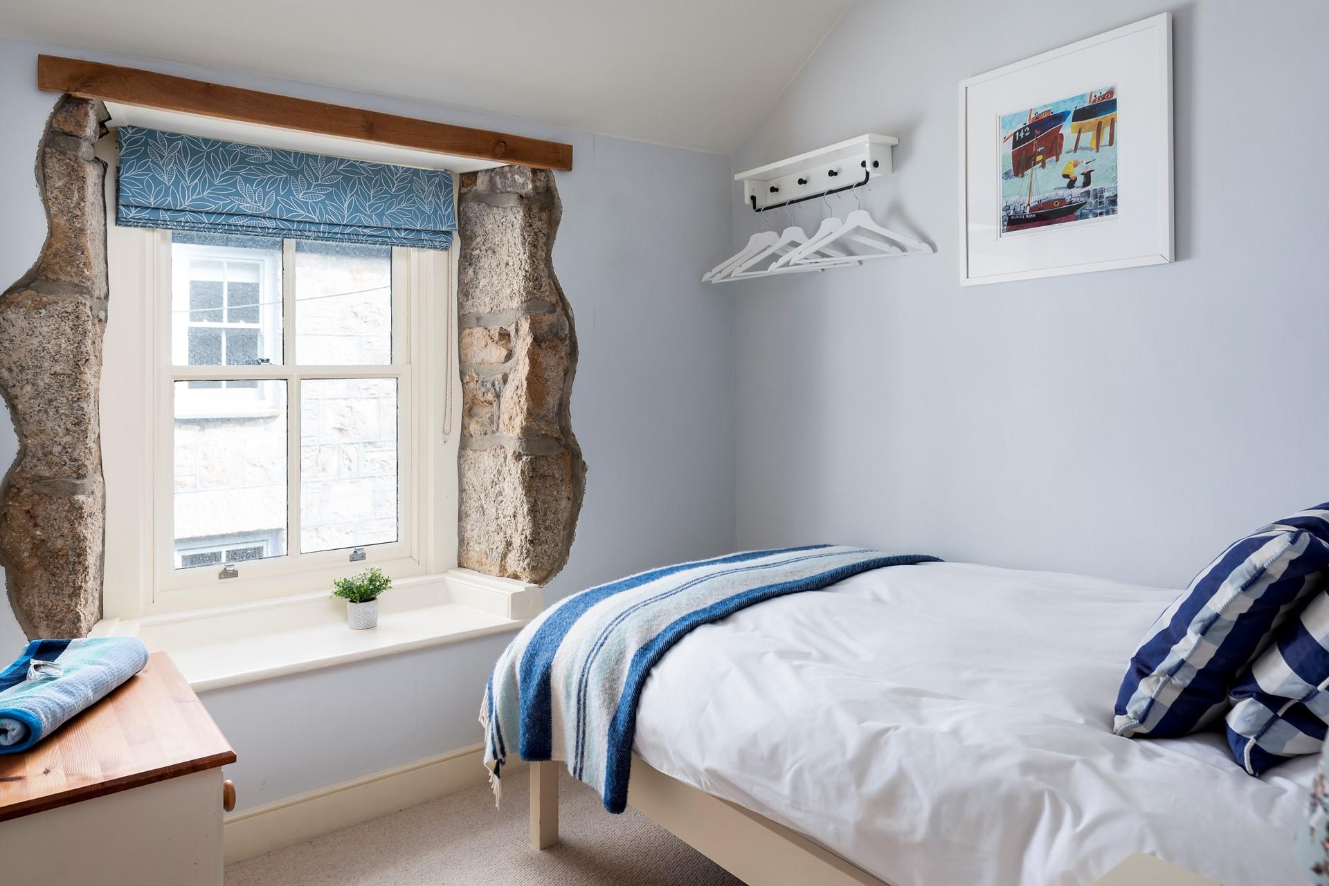 Escape to the single bedroom for a blissful night in this beautifully finished, cosy room.