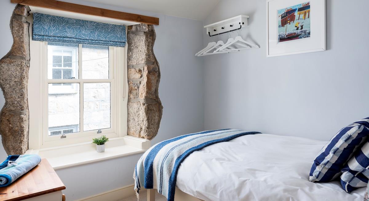 Escape to the single bedroom for a blissful night in this beautifully finished, cosy room.