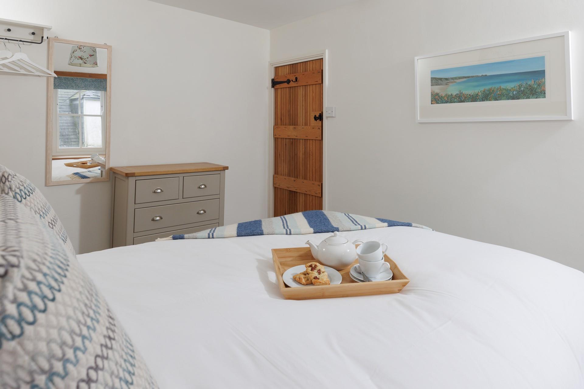 Wake up to the sound of St Ives in this bright and airy bedroom. 