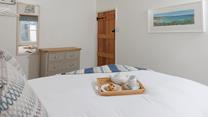Wake up to the sound of St Ives in this bright and airy bedroom. 