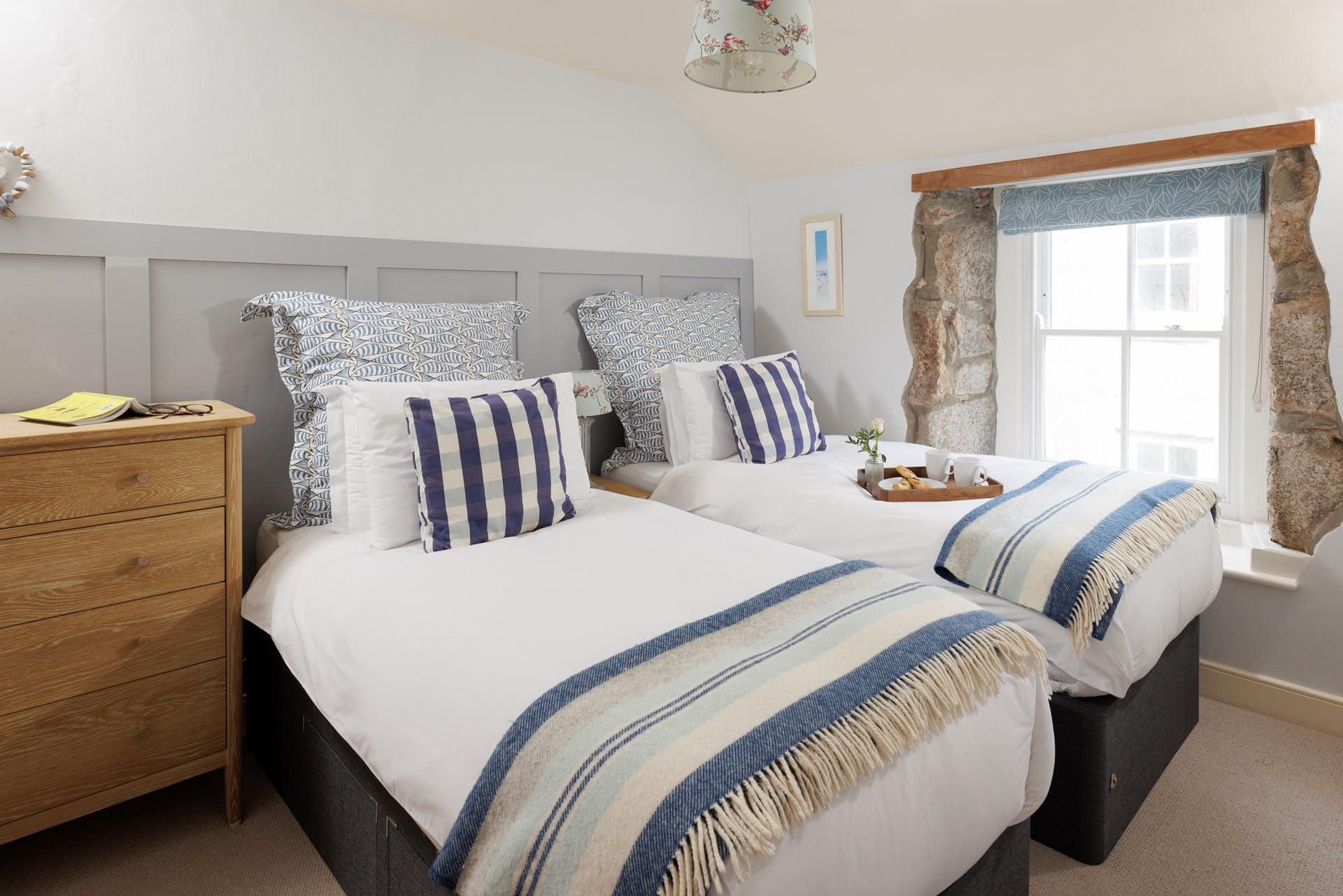 Sumptuous twin beds promise a dreamy night's sleep for guests staying in bedroom 2. 