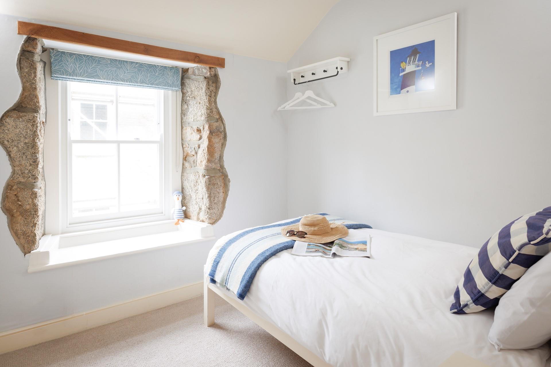 Escape to the single bedroom for a blissful night in this beautifully finished, cosy room.