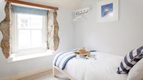 Escape to the single bedroom for a blissful night in this beautifully finished, cosy room.