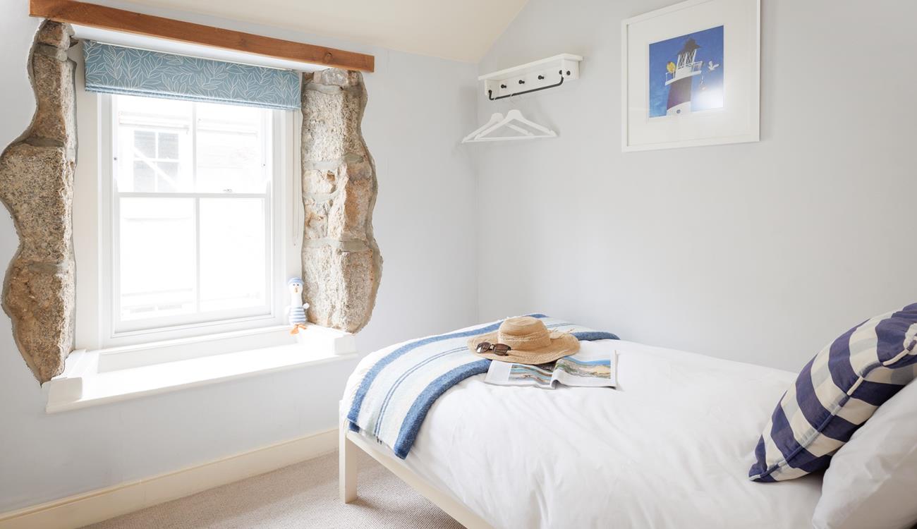 Escape to the single bedroom for a blissful night in this beautifully finished, cosy room.
