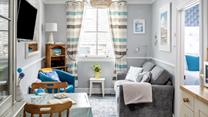 Snug and cosy, the sitting room is the perfect place to relax after a day exploring St Ives. 