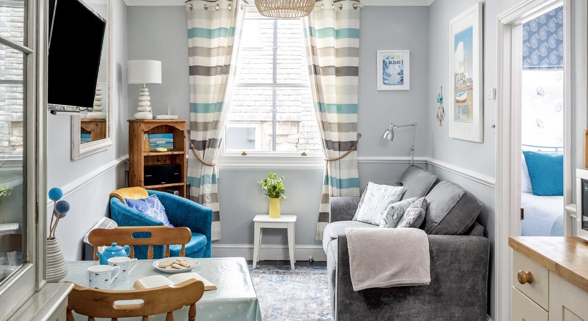 Snug and cosy, the sitting room is the perfect place to relax after a day exploring St Ives. 