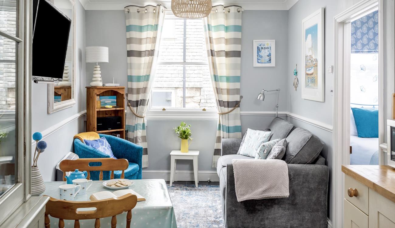 Snug and cosy, the sitting room is the perfect place to relax after a day exploring St Ives. 