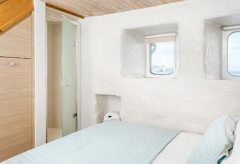 The double bedroom also features an integrated shower cubicle. 