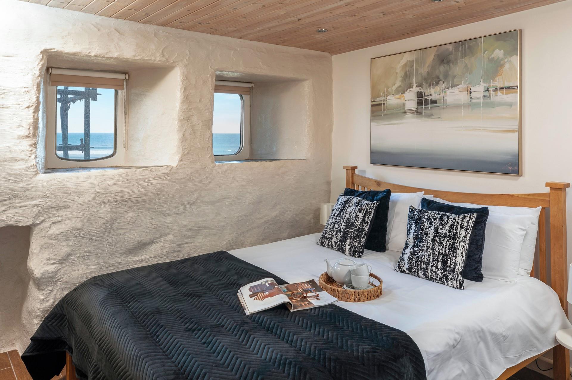 We love the port hole windows that offer far-reaching views across the ocean. 