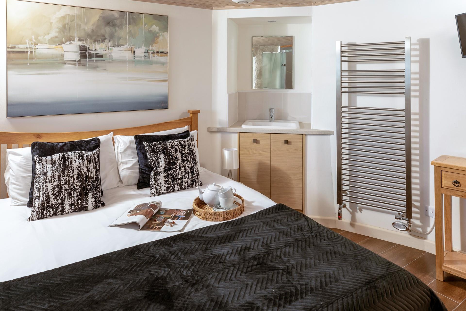 Conveniently, the bedroom also has a wash unit with sink, ideal for getting ready in the morning.