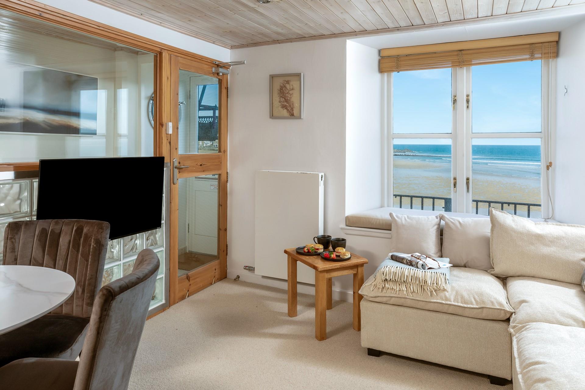 Quaint and cosy, the living area is the perfect spot to unwind after a day exploring St Ives.